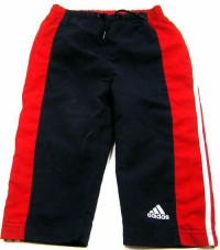 Tmavomodro-červené šusťákové oteplené kalhoty s pruhy zn. Adidas