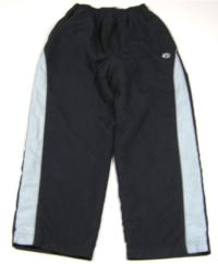 Tmavomodro-modré šusťákové oteplené kalhoty zn. Cherokee