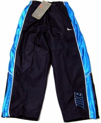 Outlet - Tmavomodré šusťákové sportovní oteplené kalhoty zn. Nike