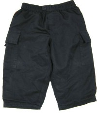 Tmavomodré šusťákové oteplené kalhoty s kapsami