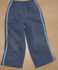 Modré zateplené šusťákové  kalhoty s pruhy zn. Adams