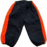 Tmavomodro-oranžové šusťákové oteplené kalhoty