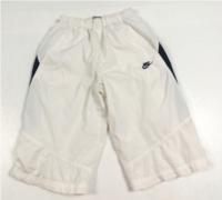 Bílé 3/4 šusťákové kalhoty s pruhy zn. Nike vel. 170