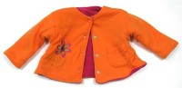 Oranžový zateplený kabátek s kytičkou