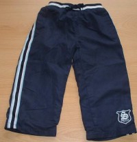 Tmavomodré šusťákové oteplené kalhoty s výšivkou a pruhy zn. St. Bernard