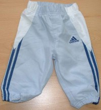 Světlemodro-bílé šusťákové oteplené kalhoty s nápisem a pruhy zn. Adidas