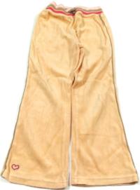 Meruňkové sametové kalhoty s proužky zn. Cherokee