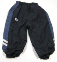 Tmavomodro-modré šusťákové oteplené kalhoty s výšivkou 