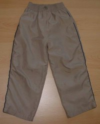 Béžové šusťákové kalhoty s podšívkou a pruhy zn. Cherokee