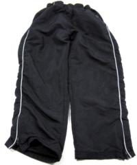 Tmavomodré šusťákové kalhoty 