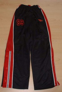 Tmavomodré sportovní kalhoty s pruhy a číslem zn. Gola