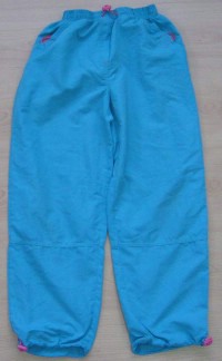 Světlemodré šusťákové kalhoty vel. 9-10 let