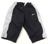 Tmavomodro-modré 3/4 šusťákové kalhoty zn. Nike