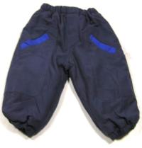 Tmavomodré šusťákové zateplené kalhoty 