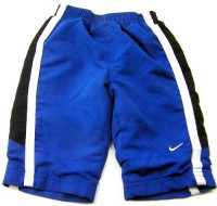 Modré šusťákové oteplené kalhoty s pruhy zn. Nike