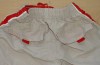 Béžovo-červené šusťákové kalhoty s nápisem a podšívkou zn. Early Days
