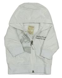 Bílá šusťáková jarní bunda s nápisem a kapucí zn. Timberland
