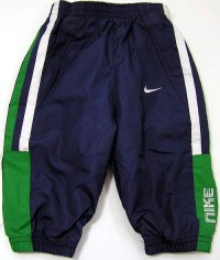 Outlet - Tmavomodré šusťákové oteplené kalhoty zn. Nike