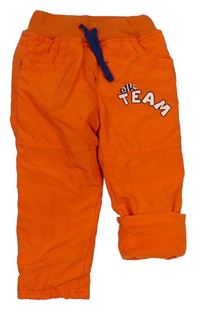 Oranžové šusťákové zateplené kalhoty s nápisem zn. Ergee