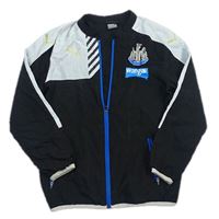 Černo-bílá šusťáková sportovní bunda Newcastle United s logem zn. Puma