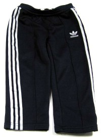 Tmavomodré sportovní kalhoty s pruhy zn.  Adidas