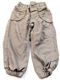 Béžové šusťákové oteplené kalhoty zn. Early days