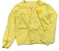 Žlutý propínací svetr s kytičkou zn. Nutmeg