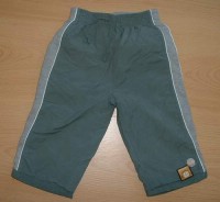 Zelené oboustranné šusťákové kalhoty/tepláčky s pruhem a nášivkami zn. Adams