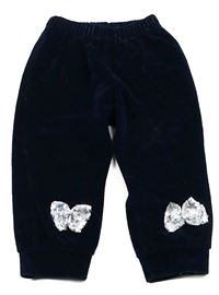 Tmavomodré sametové cuff kalhoty s mašličkami a flitry 