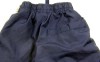 Modré 7/8 šusťákové kalhoty s číslem zn. REBEL