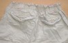 Béžové plátěné oteplené kalhoty s kytičkami zn. Geogre